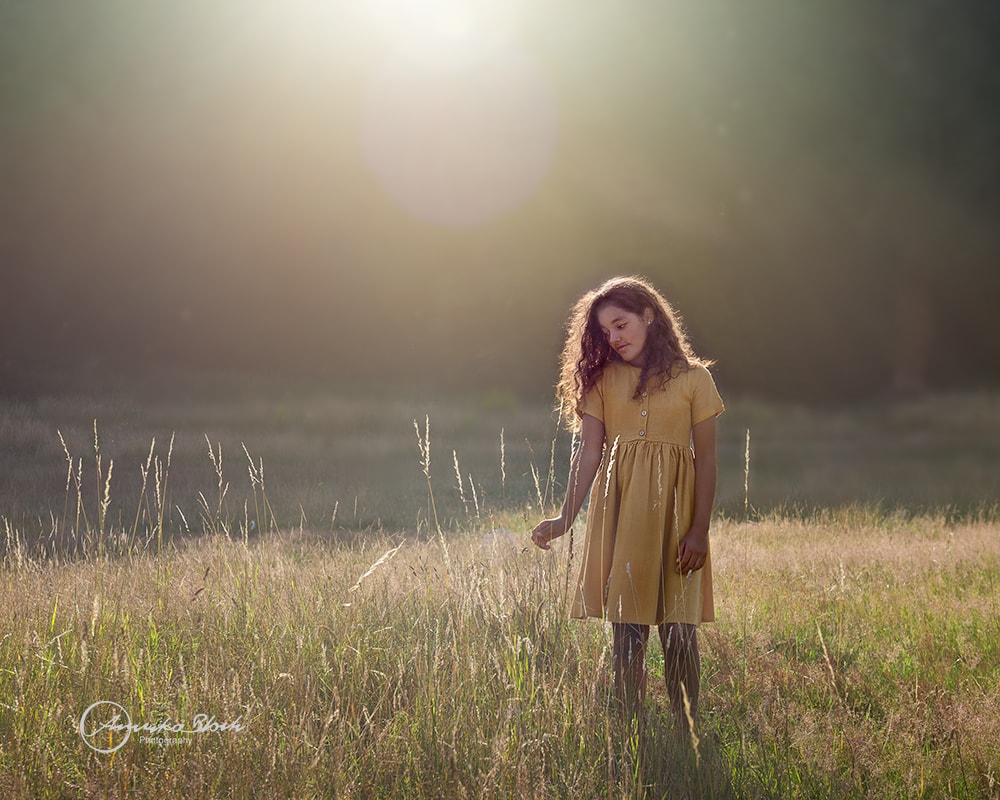 Fine art child photography, girl surrounded by nature