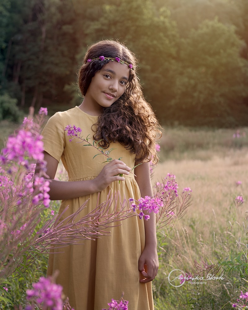Fine art child portrait photography, girl surrounded by nature