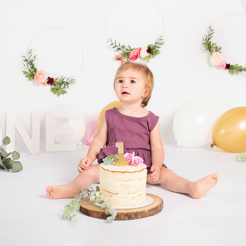 First birthday cake smash, toddler girl with birthday cake, studio photography, photographer in Maida Vale, West London, Annika Bloch Photography