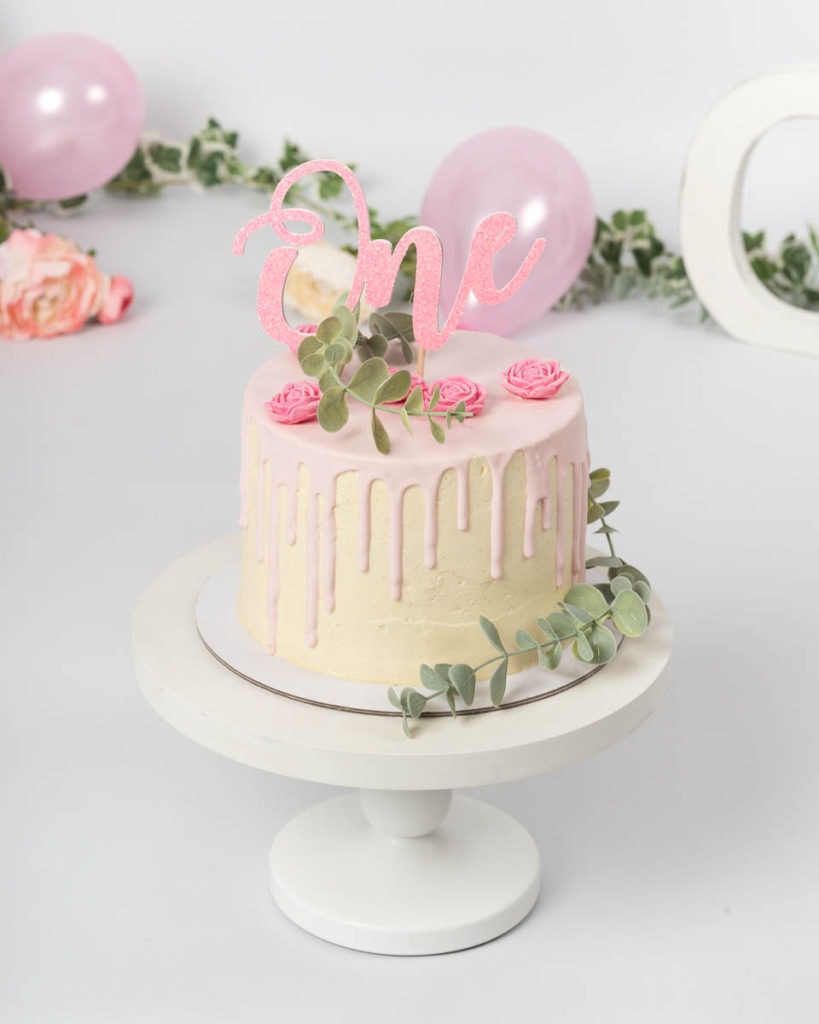 pink drip cake with flowers